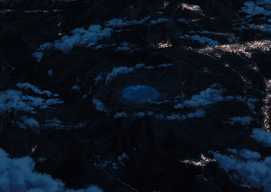 Aerial view of a crater lake at night