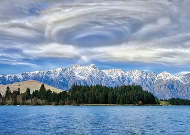 Snow-capped mountains over a lake
