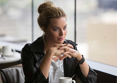 Margot Robbie in a black leather jacket