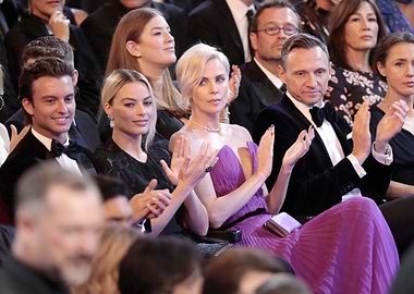 Celebrities clapping at an event