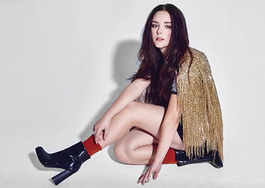 Fashionable Madison Davenport in gold fringe jacket