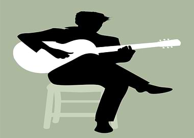 Silhouette of a man playing guitar