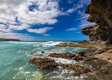 Rocky Coastline with Turquoise Ocean and Blue Sky