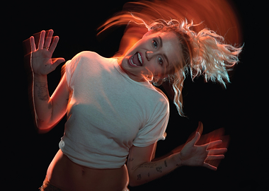Miley Cyrus dancing with light trails