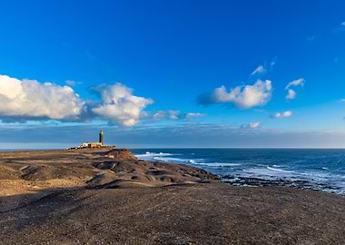 Lighthouse on a rocky coast at sunset, Canary Islands