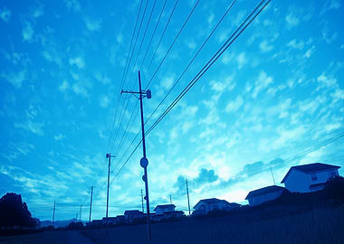 Power lines against a blue sky