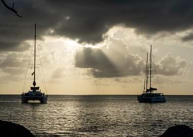 Catamarans at Sunset with Sunbeams