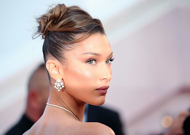 Bella Hadid wearing diamond earrings