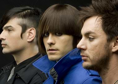 Three men in stylish coats