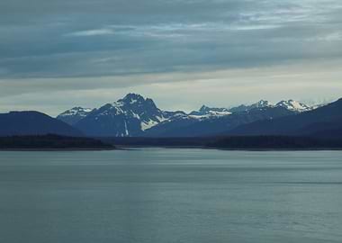 Serene Mountain Lake Under Cloudy Sky