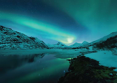 Aurora Borealis over Snowy Mountains