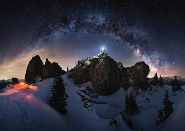 Hiker with headlamp under the Milky Way