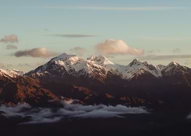 Snow-capped mountains at sunset
