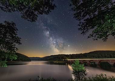 Milky Way over a lake and bridge
