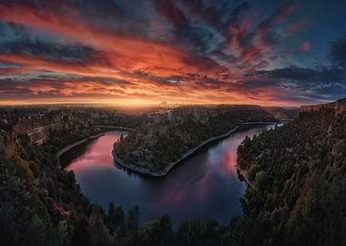 Dramatic Sunset Over a Winding River Canyon