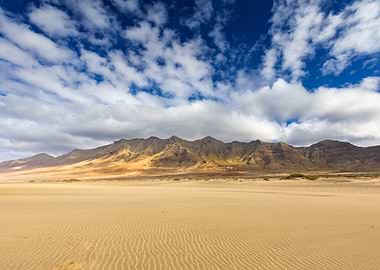 Desert landscape with mountains and clouds, Cofete Beach