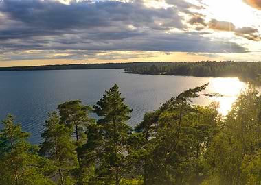 Sunset over a serene lake and forest