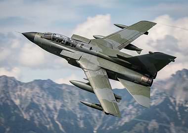Military Jet Flying Over Mountains