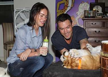 Megan Fox and Brian Austin Green with a tiger cub