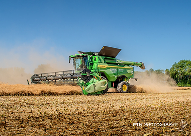 John Deere Combine Harvester in Field