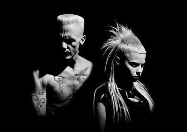 Two people with distinctive hairstyles and tattoos