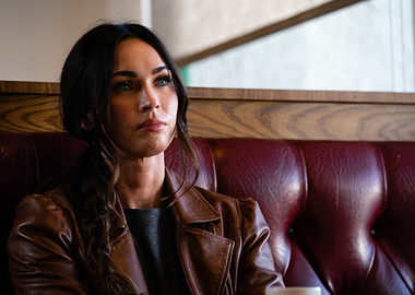 Megan Fox in a brown leather jacket