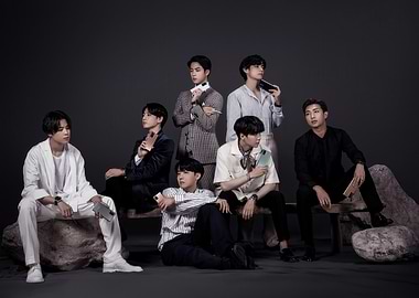 BTS members posing with phones