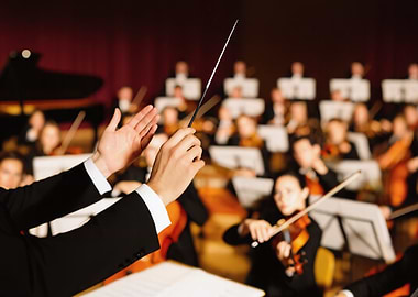 Orchestra conductor leading musicians