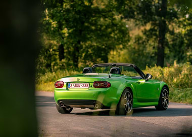 Green Mazda Miata Convertible Driving