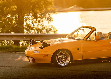 Yellow Mazda Miata Convertible at Sunset