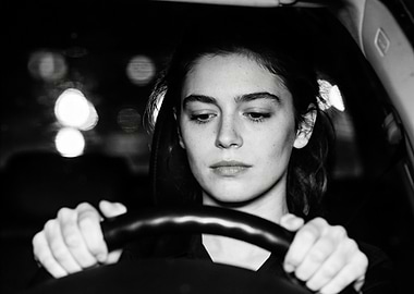 Woman driving at night