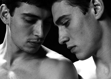 Two men in close embrace