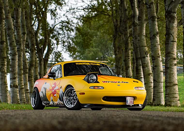 Yellow Mazda Miata with Japanese Art