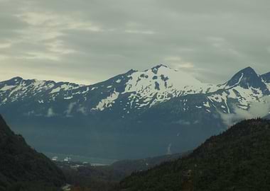 Snow-capped mountains over a valley