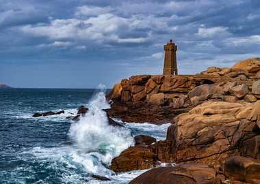 Lighthouse on a rocky coast with crashing waves