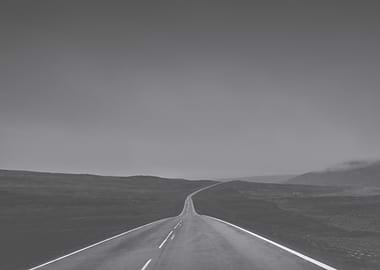 Empty Road Through Barren Landscape