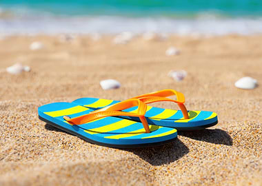 Striped Flip-Flops on a Sandy Beach