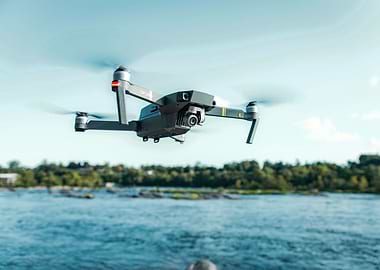 Drone flying over water