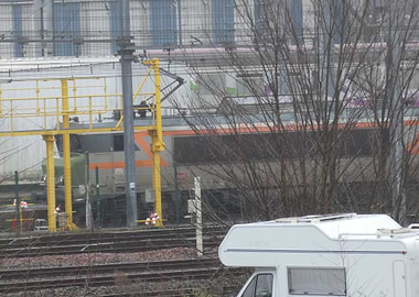 Train and RV in industrial setting