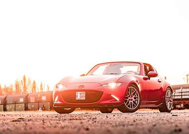 Red Mazda MX-5 Convertible at Sunset