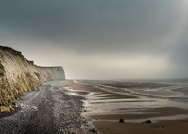 Misty Beach Cliffs and Shoreline
