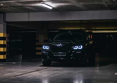 Black BMW SUV in Parking Garage