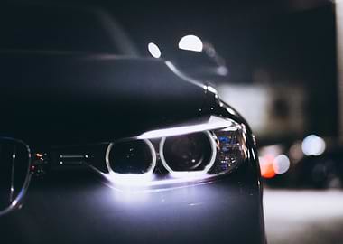 Close-up of a car's headlights at night