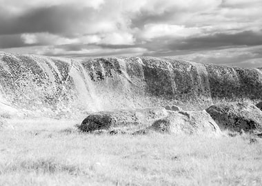 Dramatic Rocky Landscape Under Cloudy Sky