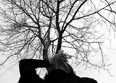 Woman with Flowers Under Tree