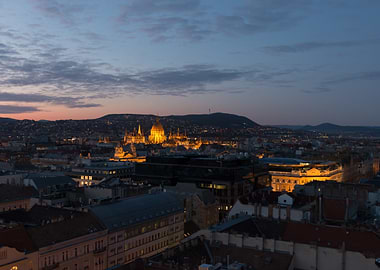Cityscape at Dusk with Illuminated Buildings