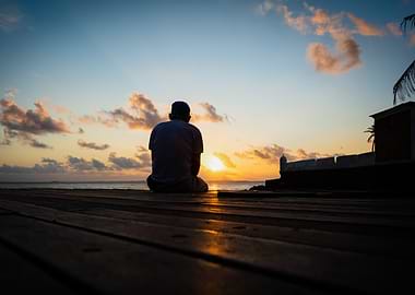 Man watching sunset by the sea