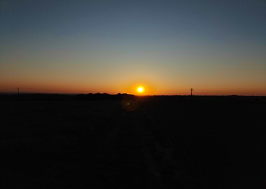 Sunset over a dark landscape