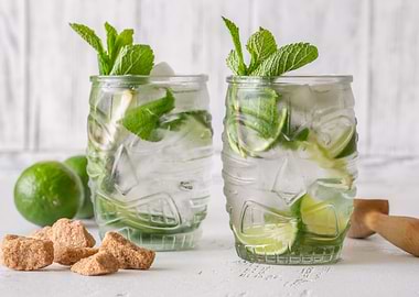 Two refreshing mojitos with mint and lime