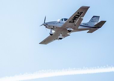 Airplane in flight against blue sky